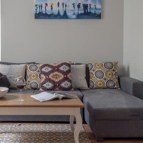 Kick back on the comfortable sofa with a glass of wine after a day of Madrid sightseeing