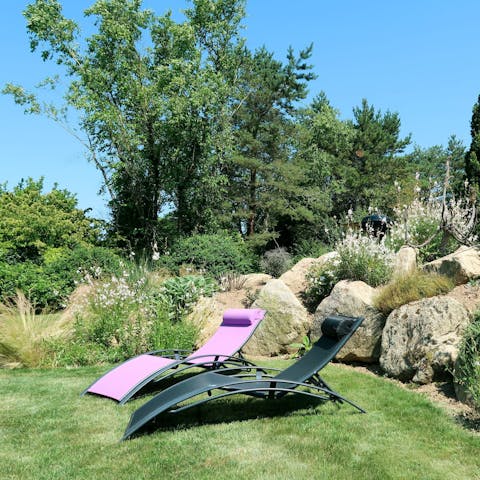 Relax and recline in the expansive garden