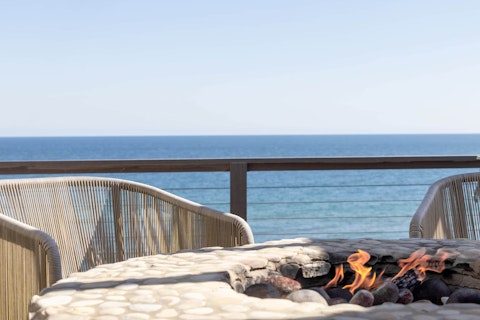 Gather round the fire pit as the Atlantic stretches ahead