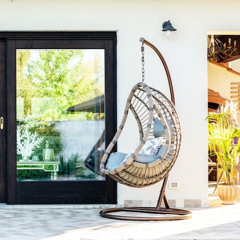 Get cosy on the swing, perfect for naps, reading and sipping wine under the stars