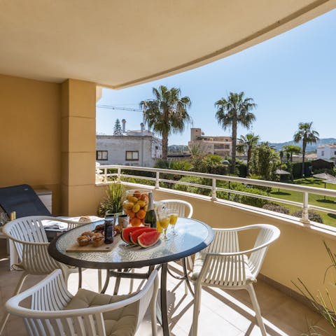 Gaze out at the views of the mountains in the distance from your private balcony