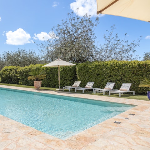 Cool off or soak up the sun by the private pool
