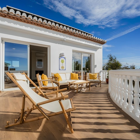 Sip a glass of Spanish sangria on your sun-kissed balcony