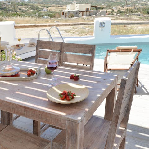 Share a bottle of wine alongside a delicious meal on the terrace