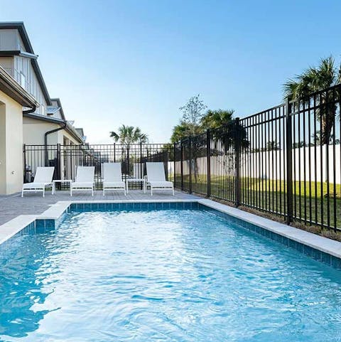 Swap between swimming lengths and lounging by the side of the pool