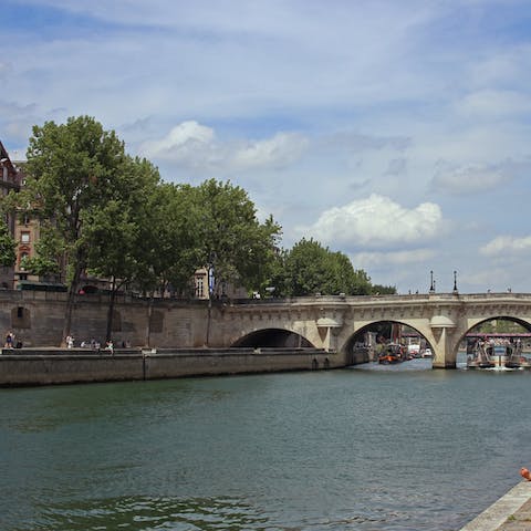 Grab a coffee to go and take a stroll along the Seine River – it's just fourteen minutes away