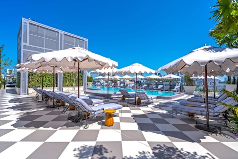 Stretch out beside the pool under open Miami skies