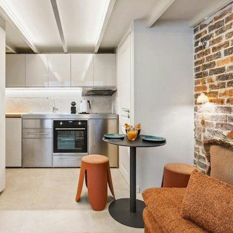 Have a glass of French white wine in the open-plan living room