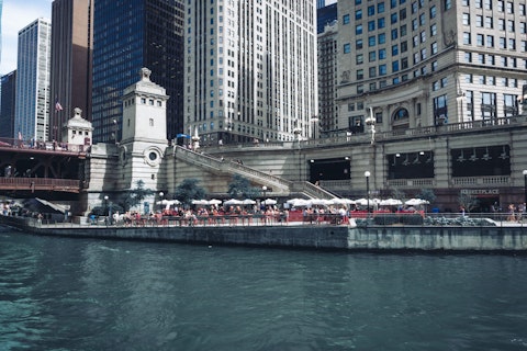 Stroll the Chicago Riverwalk's vibrant waterfront lined with bars, cafés, and kayak launches, a ten-minute walk