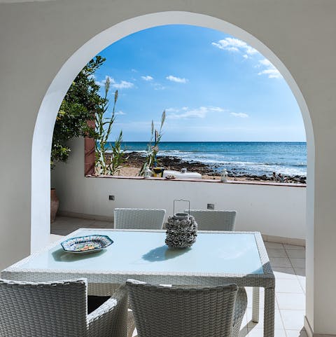 Enjoy long alfresco lunches with a gentle sea breeze blowing through the archway