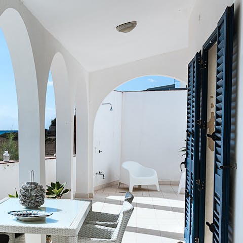 Cool off in the outdoor shower after a swim in the sea