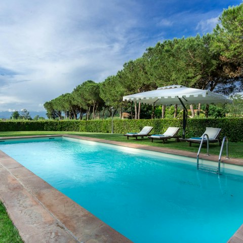 Stretch out by the pool with sweeping views of the Tuscan countryside