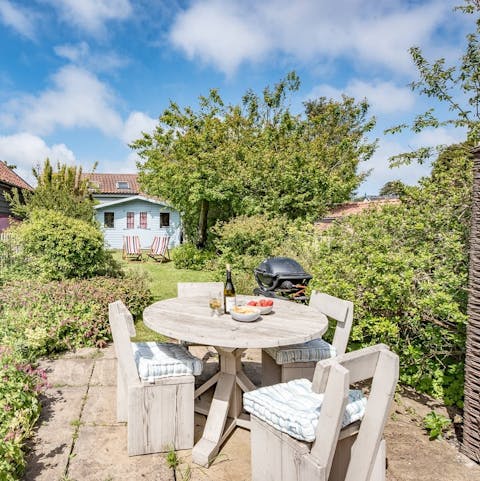 Light the barbecue and savour lingering lunches in the garden