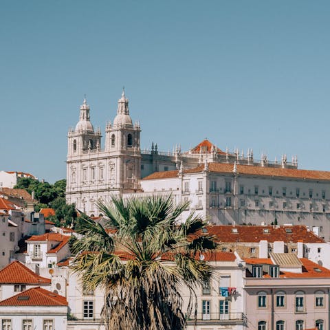 Take a twenty minute walk down hill to the historic Alfama neighbourhood