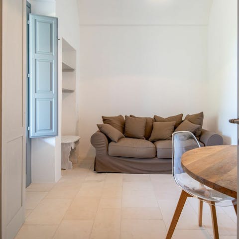 Relax in the master bedroom's private lounge area – complete with kitchenette and dining table