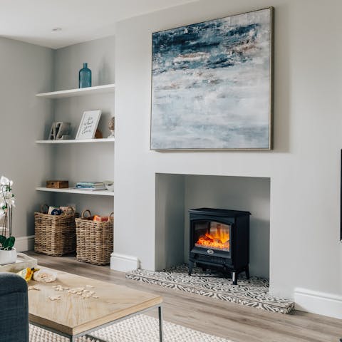 Snuggle up in front of the fireplace, after a day out on the beach