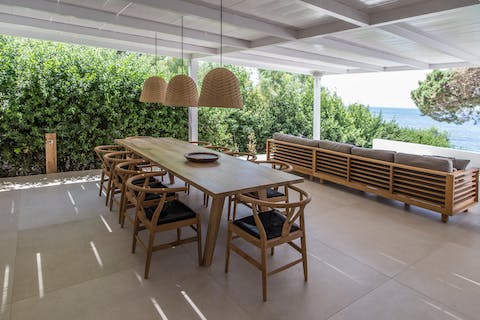 Serve up a delicious home-cooked meal under the shady pergola