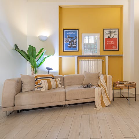 Kick back in the stylish living area with a glass of Italian wine after a day of touring the city