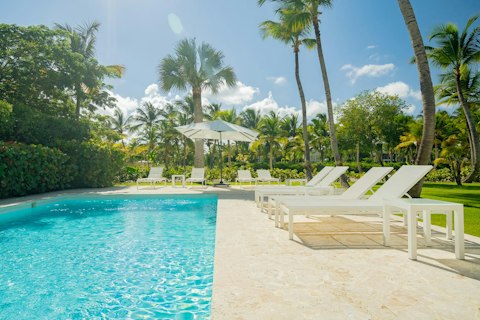 Cool off in the pool beneath a blazing Caribbean sky