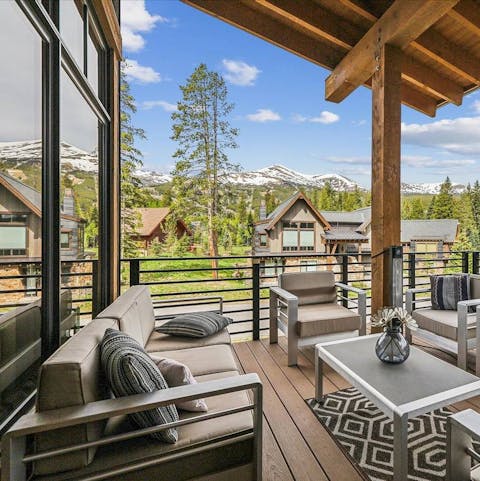 Admire views of the surrounding peaks as you relax on the private deck