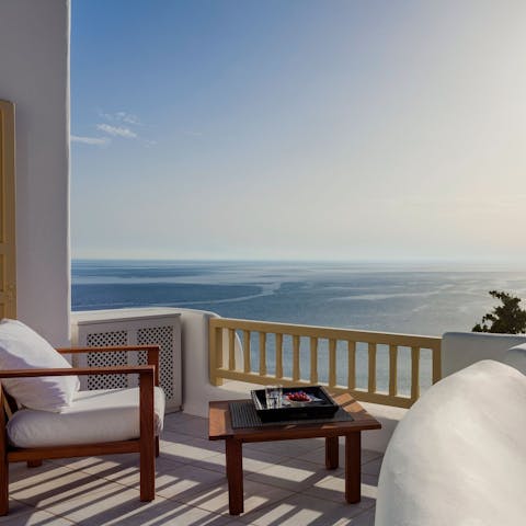 Enjoy your morning coffee with breathtaking views over the Aegean Sea