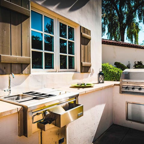 Make use of the outdoor kitchen