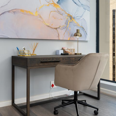 Set up your laptop at the desk and work through your emails