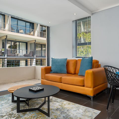 Kick back on the comfortable loveseat with a glass of your favourite tipple