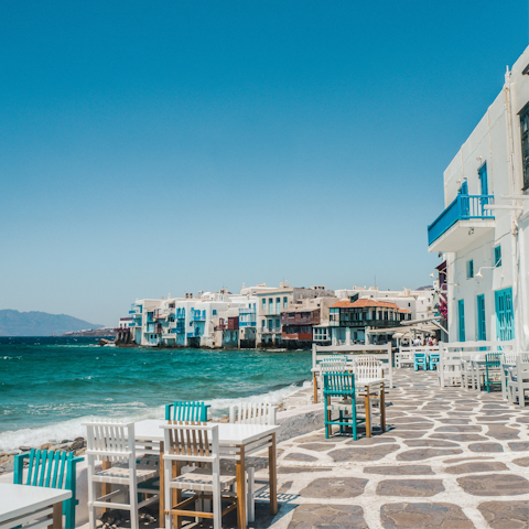 Discover the whitewashed town of Mykonos, a three-minute drive away