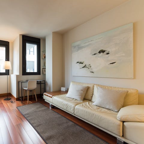 Rest weary legs on the white leather sofa after a day exploring Las Palmas, a glass of sangria in hand