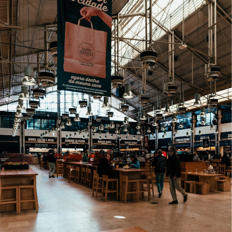 Sample Portuguese cuisine at Mercado da Ribeira's food hall