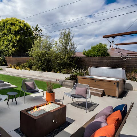 Chill by the fire pit or soak in the hot tub