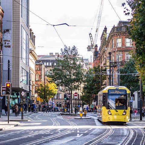 Take the tram into central Manchester