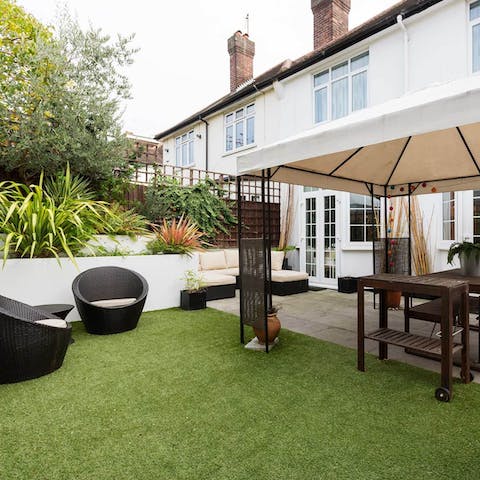 Drink Pimms in the delightful, marquee-covered garden and patio