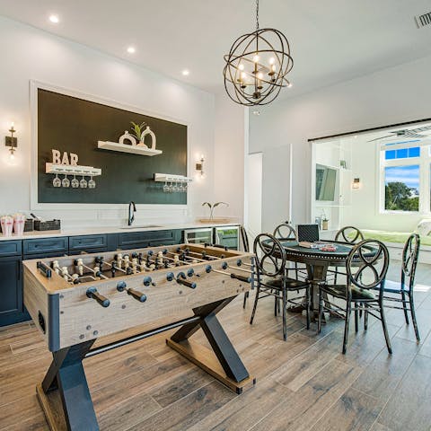 Enjoy a game of table football or poker in the club room