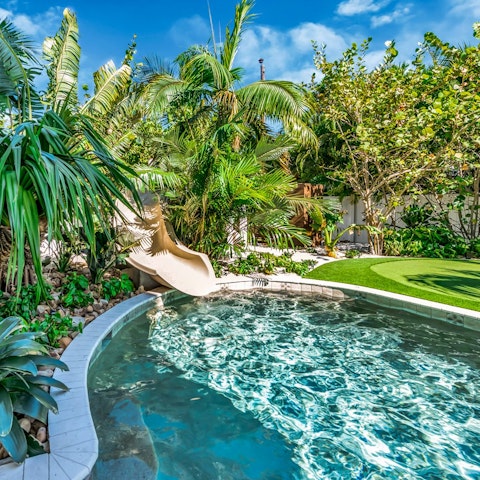 Unwind in the pool in the lush garden