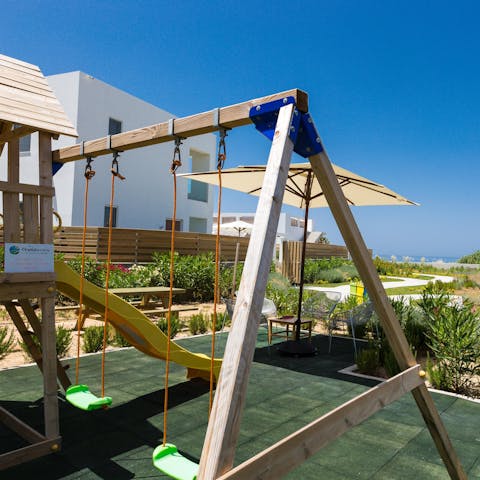 Watch the kids let off steam at the play area