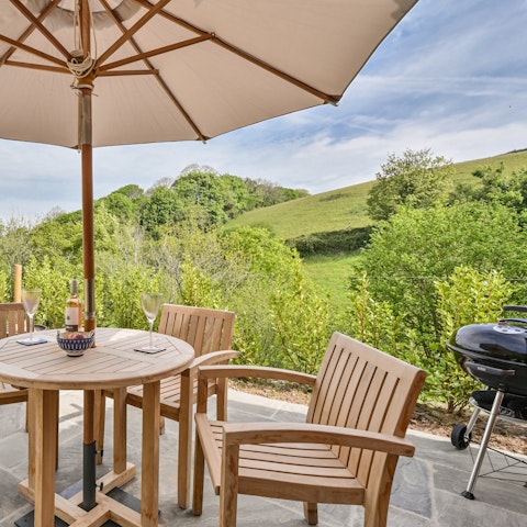 Fire up the barbecue and dine alfresco accompanied by views of the Devon countryside