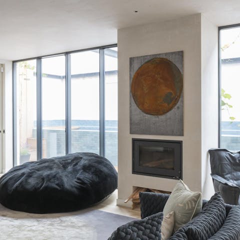 Curl up by the living room's fireplace