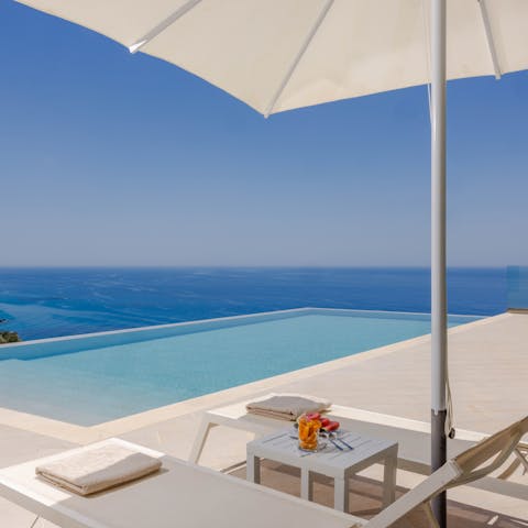 Watch the sunset from the edge of the shimmering infinity pool