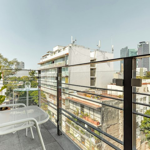 Relax on the balcony with views of the skyline