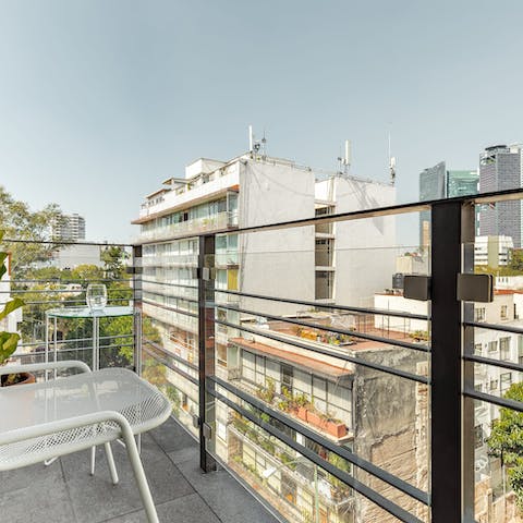 Relax on the balcony with views of the skyline