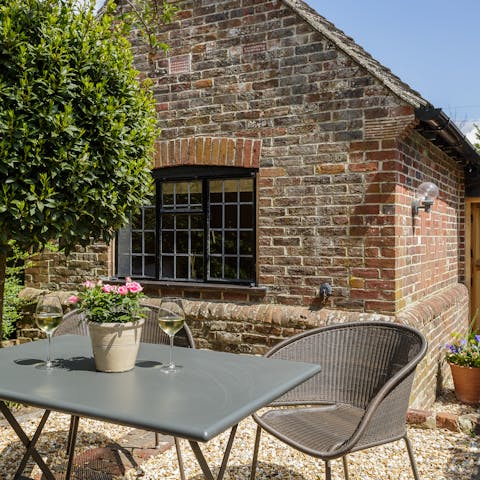 Catch the golden hour with a glass of wine on the home's private patio