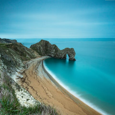 Discover the iconic Durdle Door, sixteen-minutes away by car