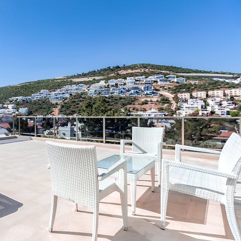 Sip a glass of wine as you watch the sunset from the roof terrace