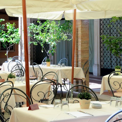 Dine like a local in the courtyard restaurant in your building