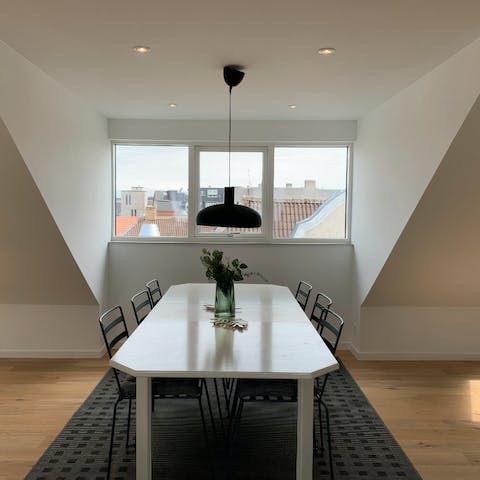 Enjoy homecooked Danish cuisine next to a view of Aalborg's rooftops