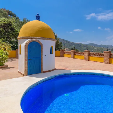 Slip into your swimsuit before diving into the pristine pool