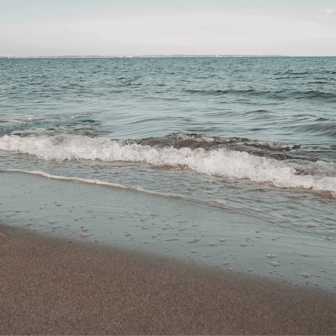 Stroll to the golden shores of Vourvoulos Beach in just five minutes