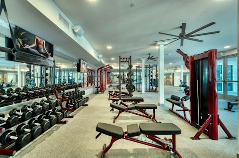 Lift weights in a full-scale gym steps from your door